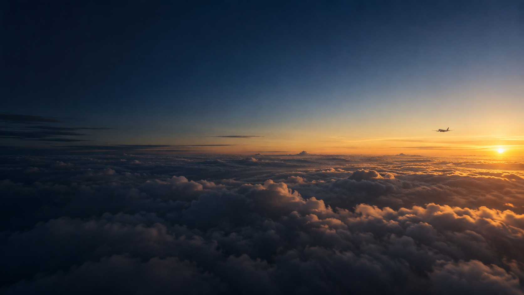 A small aircraft above the clouds, flying toward a golden dawn.